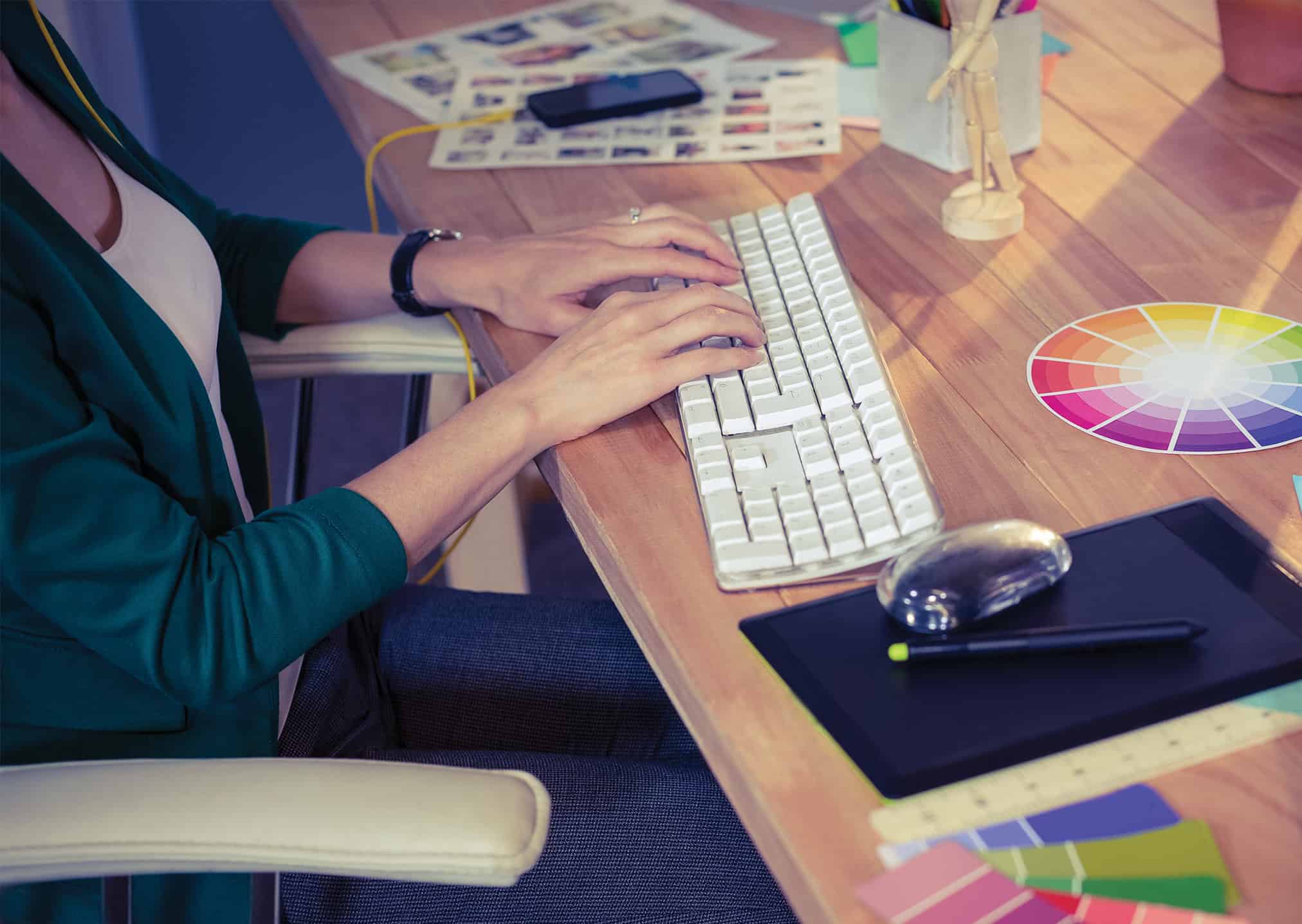 CT Gold @ Macpherson | Freehold B1 Industrial Designer working at her desk in creative office